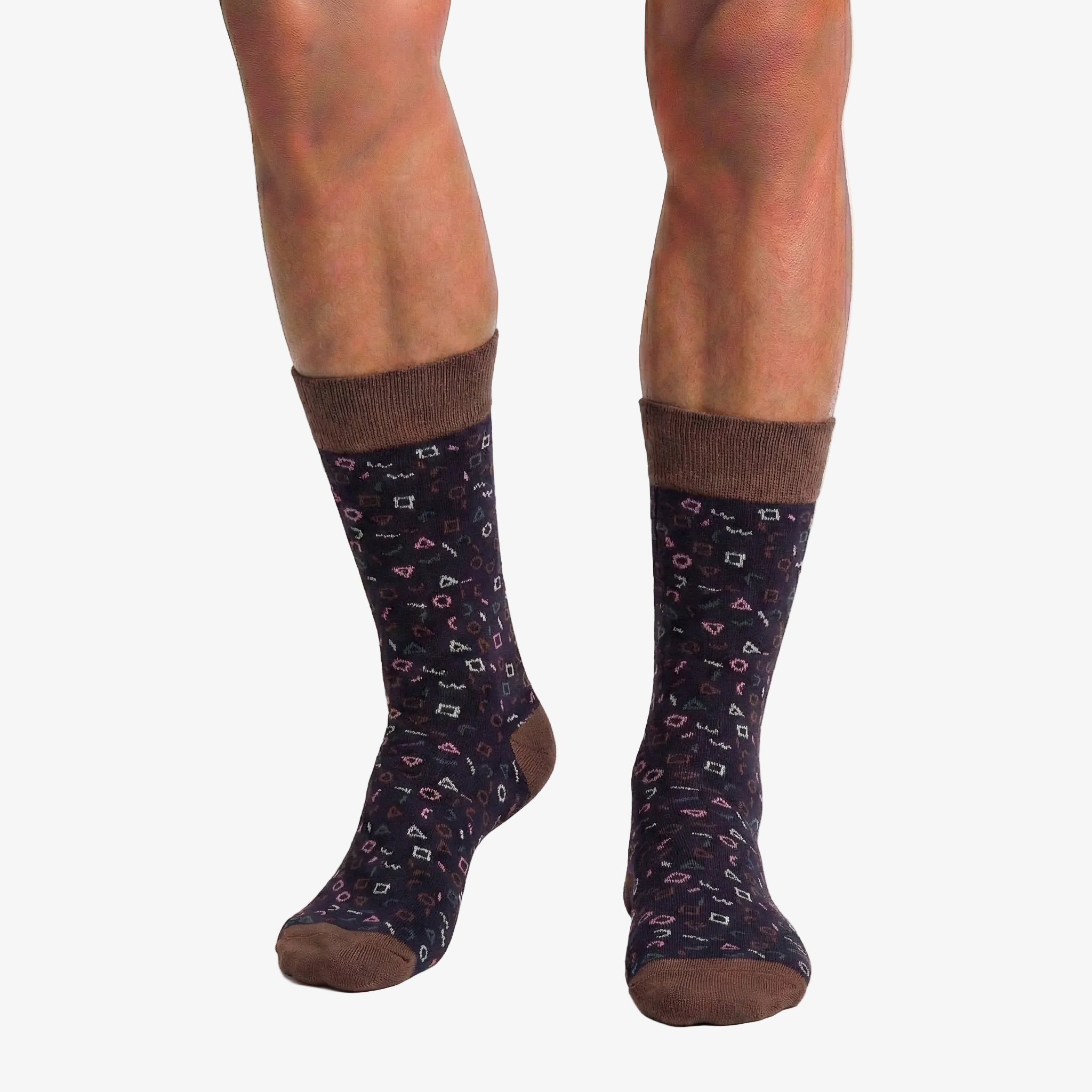 Patterned socks worn by a person on a white background