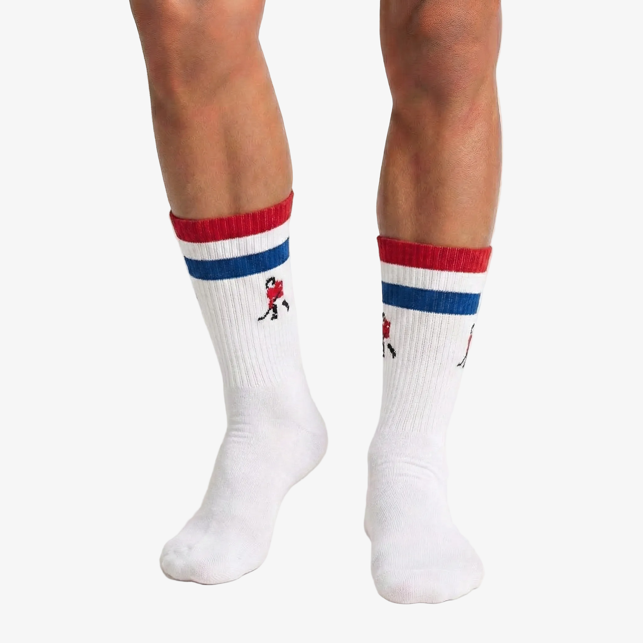 White hockey socks with red and blue stripes worn by a person on a white background
