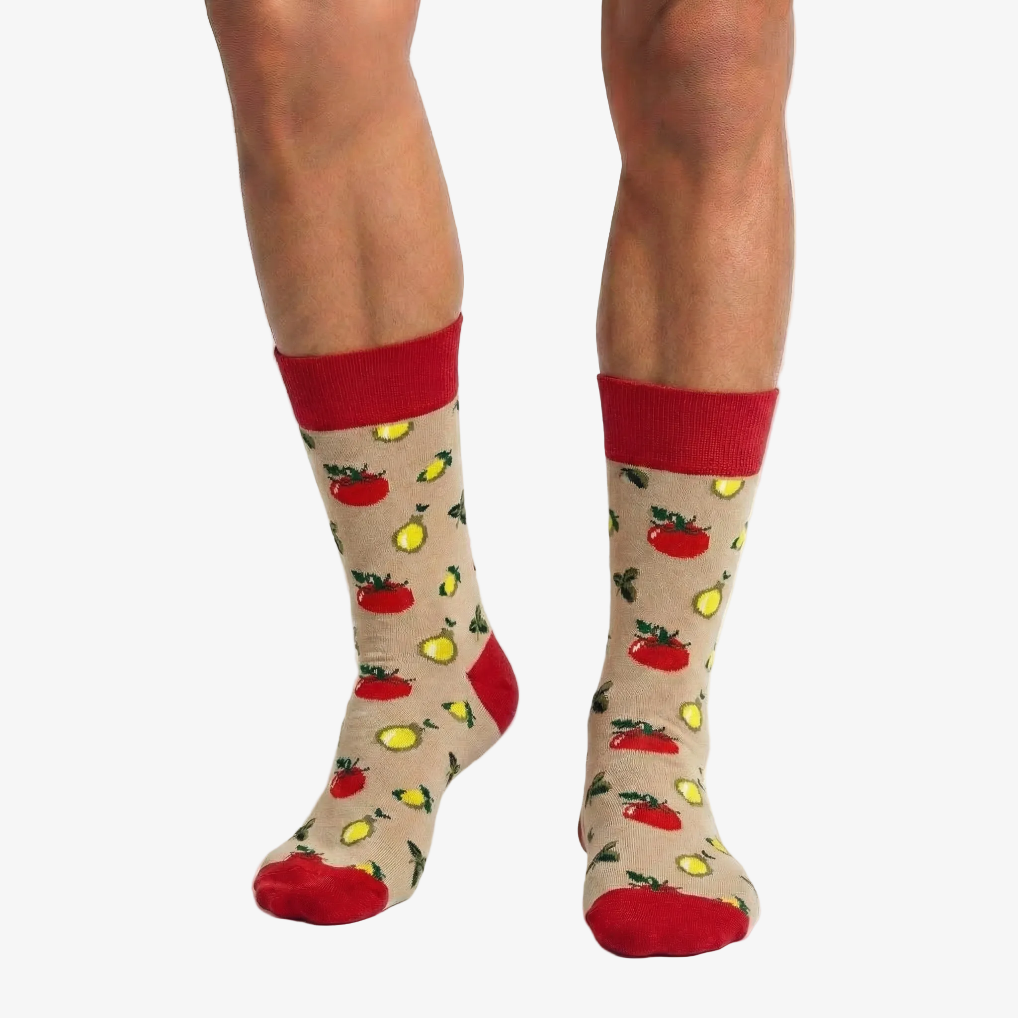 Beige socks with red, yellow, and green food patterns worn by a person on a white background