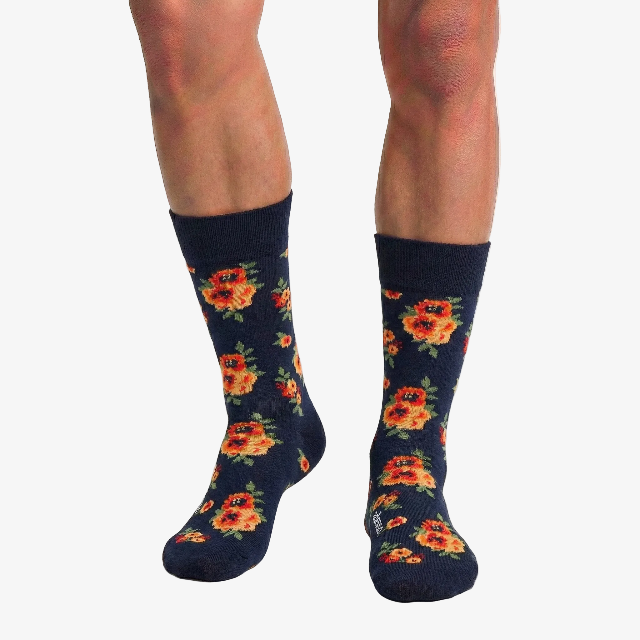 Navy socks with floral pattern worn by a person on a white background